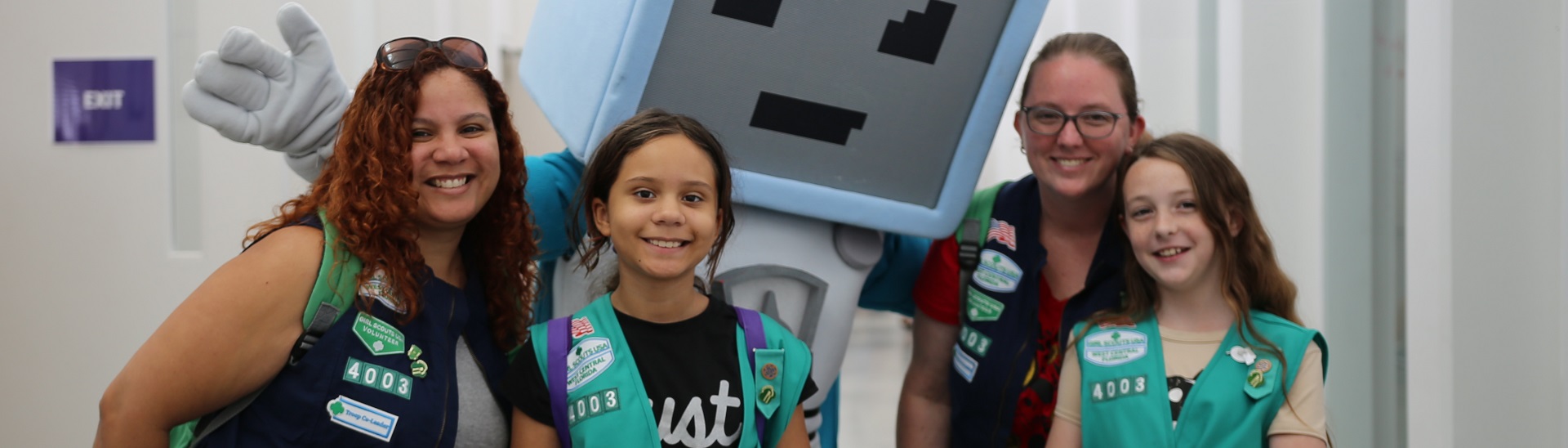  two adult girl scout lifetime members smiling and talking outside 